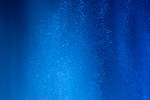 Abstract background of water drops in neon lighting. For design and networking.