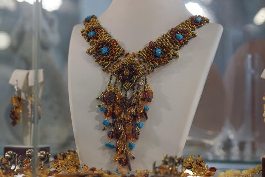 Beautiful amber jewelry on the shop window.
