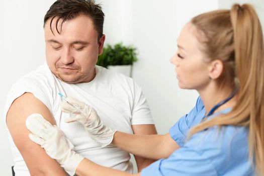 woman doctor giving injections vaccination health hospital. High quality photo