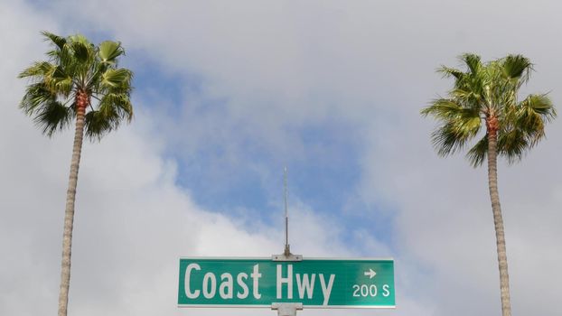 Pacific Coast Highway, historic route 101 road sign, tourist destination in California USA. Lettering on intersection signpost. Symbol of summertime travel along the ocean. All-American scenic hwy.