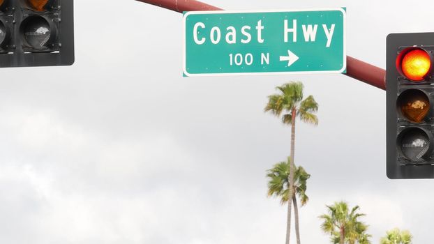 Pacific Coast Highway, historic route 101 road sign, tourist destination in California USA. Lettering on intersection signpost. Symbol of summertime travel along the ocean. All-American scenic hwy.