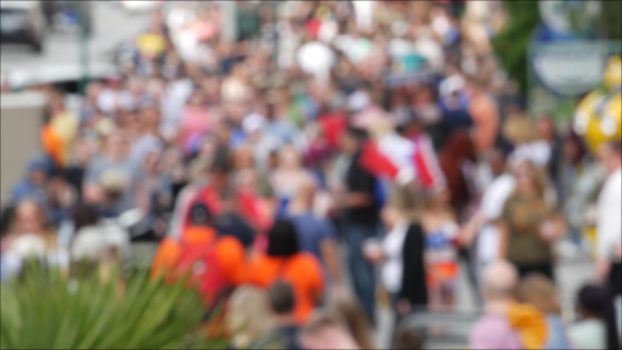 Defocused crowd of people, road intersection crosswalk on The Strip of Las Vegas, USA. Anonymous blurred pedestrians on walkway in crowded urban downtown. Unrecognizable american citizens in sin city.