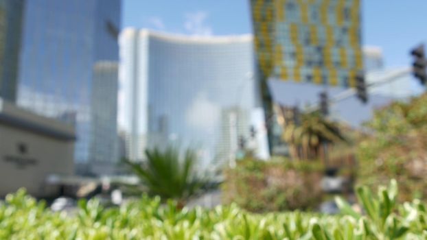 Defocused Las Vegas futuristic CityCenter casino complex in sin city downtown. Modern luxury hotels unincorporated urban skyline, Harmon ave, USA. Contemporary metropolis premium highrise skyscrapers.
