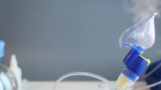 Oxygen mask of nebulizer, medical equipment for pneumonia, covid, sars and bronchitis treatment. Inhaler, respiratory pulmonary disease recovery. Flu, cough and bronchial asthma therapy.