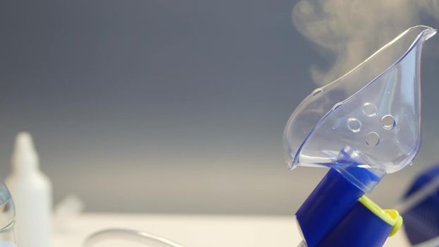 Oxygen mask of nebulizer, medical equipment for pneumonia, covid, sars and bronchitis treatment. Inhaler, respiratory pulmonary disease recovery. Flu, cough and bronchial asthma therapy.