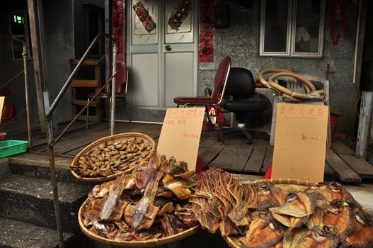 Local market stall with assortment of exotic dried food for sale. Exotic dried seafood for sale on street market