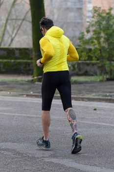 terni,italy february 11 2021:man runs to the park early in the morning