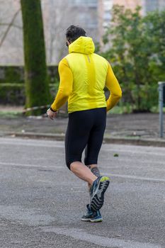 terni,italy february 11 2021:man runs to the park early in the morning