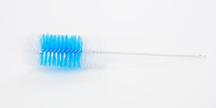 brush for washing bottles on a white background, top view