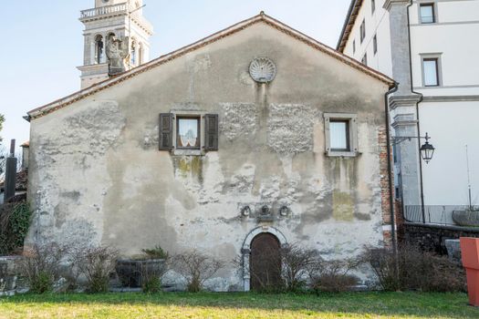 Udine, Italy. February 11, 2020. external view of the  casa della confraternita (the house of Confraternity) on the castle hill