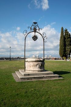 Udine, Italy. February 11, 2020. the well in the center of the meadow on the castle hill in the city center