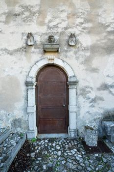 Udine, Italy. February 11, 2020. The door entrance of the  casa della confraternita (the house of Confraternity) on the castle hill