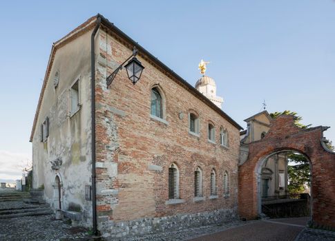 Udine, Italy. February 11, 2020. external view of the  casa della confraternita (the house of Confraternity) on the castle hill
