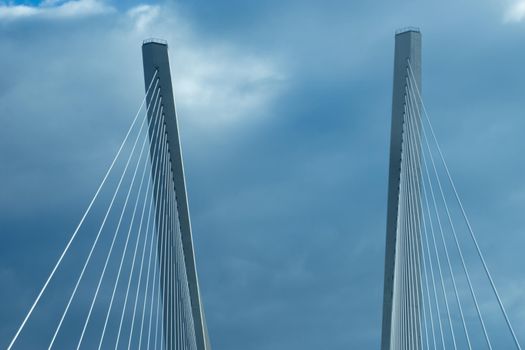 Construction of the Golden bridge against the blue sky. Vladivostok, Russia