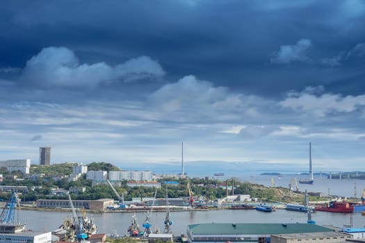 Vladivostok, Russia. Cityscape with views of the Bay of Diomedes and the Russian bridge. Magnificent sky over the city.