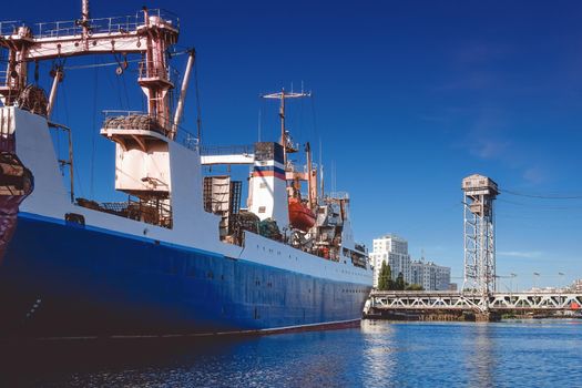 Kaliningrad , Russia. Port of a large Russian city with ships and various equipment on the background of the river.