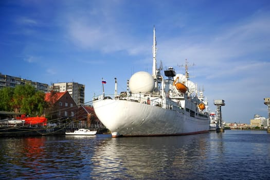 Urban landscape with a large white ship at the pier. Kaliningrad, Russia