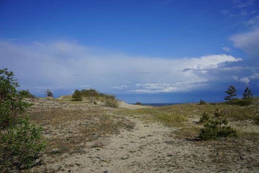 Deserted seascape on the Baltic sea and sand dunes