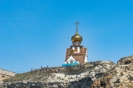 Crimean landmark: Cape Tarkhankut with beautiful rocks on the background of the sea and sky.