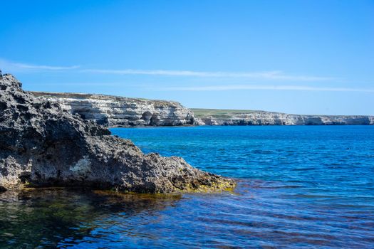 The steep and steep coast of Cape Tarkhankut and the deep Black sea in Crimea. Sunny day