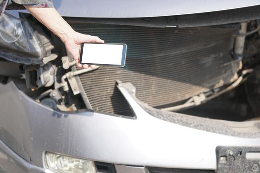 hand take photo of crashed damaged broken car. automobile crash collision accident
