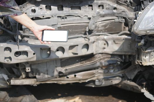 hand take photo of crashed damaged broken car. automobile crash collision accident