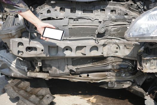 hand take photo of crashed damaged broken car. automobile crash collision accident