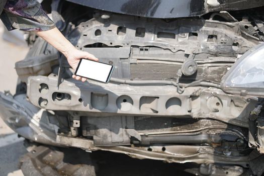 hand take photo of crashed damaged broken car. automobile crash collision accident