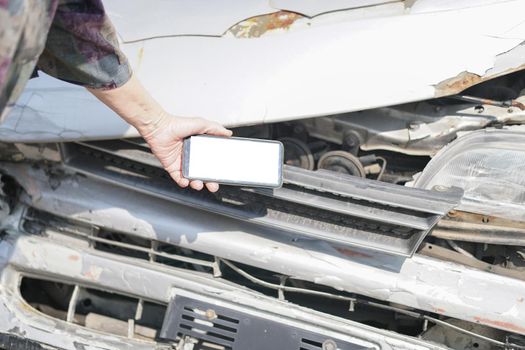 hand take photo of crashed damaged broken car. automobile crash collision accident
