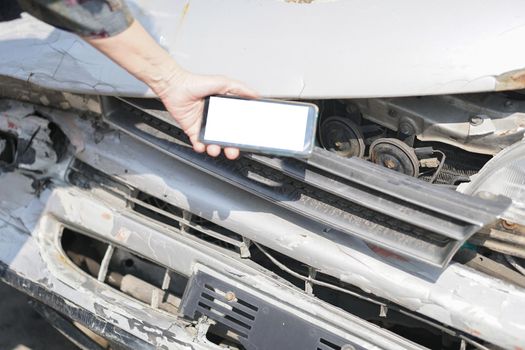 hand take photo of crashed damaged broken car. automobile crash collision accident