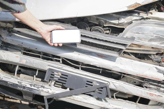 hand take photo of crashed damaged broken car. automobile crash collision accident