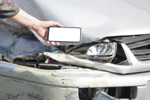 hand take photo of crashed damaged broken car. automobile crash collision accident