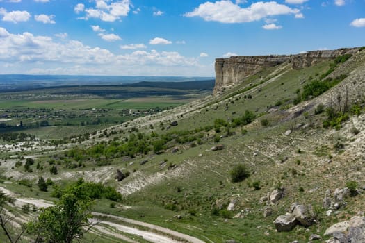 Mountain landscape with views Of the AK-Kaya mountain in the Crimea against the blue .