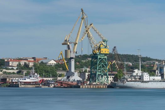 Industrial landscape with cranes in the seaport of Sevastopol.