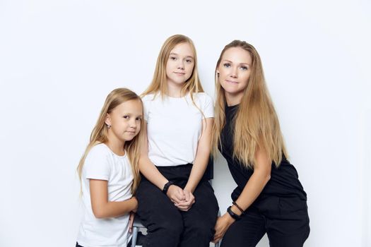 mom with two daughters family photo joy friendship. High quality photo