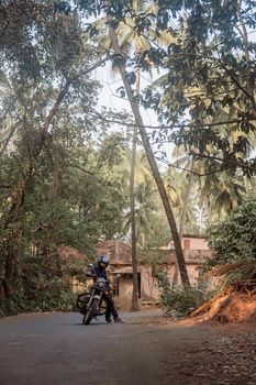 A Man On Motorcycle On Road in GOA village