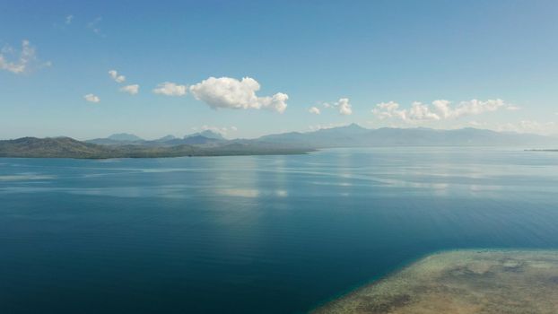 aerial view Seascape: Honda bay with boats and sea with blue water and tropical islands covered with forest. Puerto princesa, Palawan, Philippines.