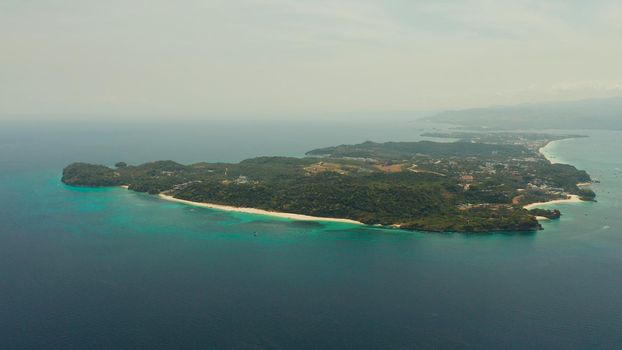 Costline of the tropical island of Boracay with sandy beaches and hotels from above. Summer and travel vacation concept. Philippines.