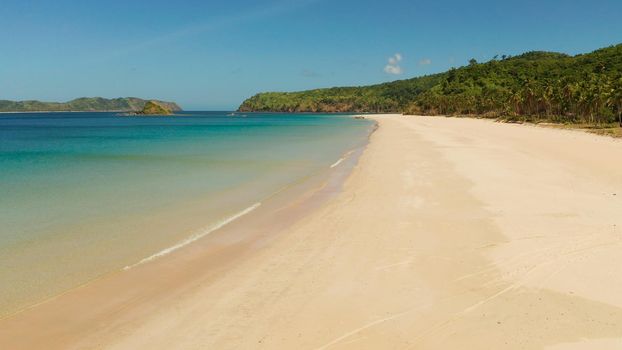 Wide sand beach Nacpan Beach, aerial view. El Nido, Palawan, Philippine Islands. Seascape with tropical beach and islands. Summer and travel vacation concept
