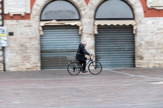 terni ,italy february 12 2021:man panning on bicycle in the city