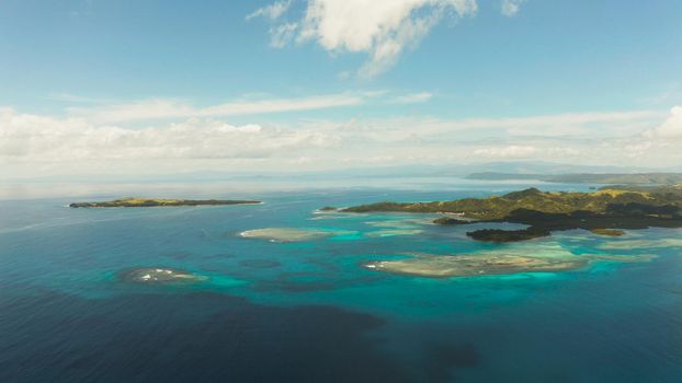Seascape: Tropical Islands with beaches and azure coral reef water from above. Bucas grande, Philippines. Summer and travel vacation concept.