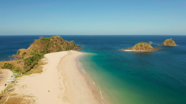 Wide sand beach Nacpan Beach, aerial view. El Nido, Palawan, Philippine Islands. Seascape with tropical beach and islands. Summer and travel vacation concept