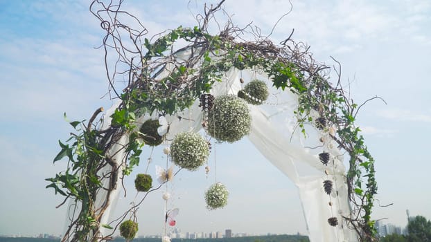 Arch for the wedding ceremony, decorated with cloth and flowers. Decorated with flowers Wedding frame.