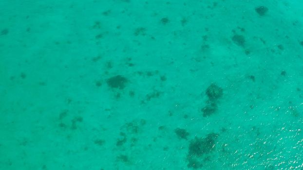 Sailing yacht in lagoon turquoise water, aerial view. Sailing boat glides over the waves, Summer and travel vacation concept