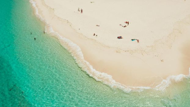 Tropical island with beautiful beach, and turquoise water view from above. Daco island, Philippines. Summer and travel vacation concept