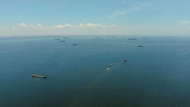 Arial view of ships at anchor in Manila Bay. Cargo ships in the harbor.
