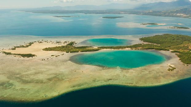 aerial view Honda bay with tropical islands and sandy beaches surrounded by coral reef with azure water. Summer and travel vacation concept, Puerto princesa, Palawan, Philippines.