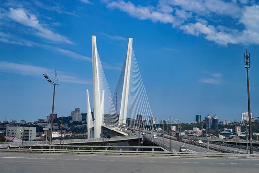 Vladivostok, Primorsky Krai. Cityscape with views of the Golden bridge and the road.