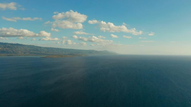 Cloud scape: Blue sky with clouds over the sea and islands, aerial view. Seascape: Ocean and sky, Cebu, Philippines.