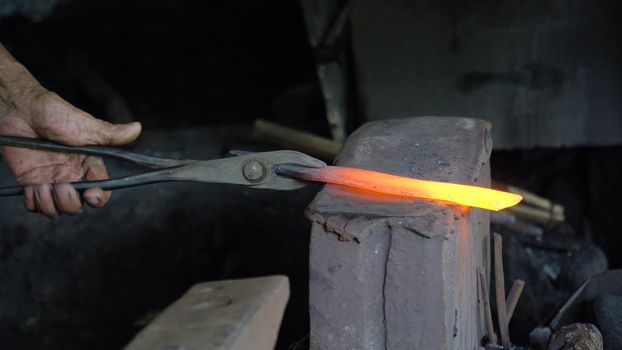 Hot metal is processed on the anvil in the forge. Anvil in the forge